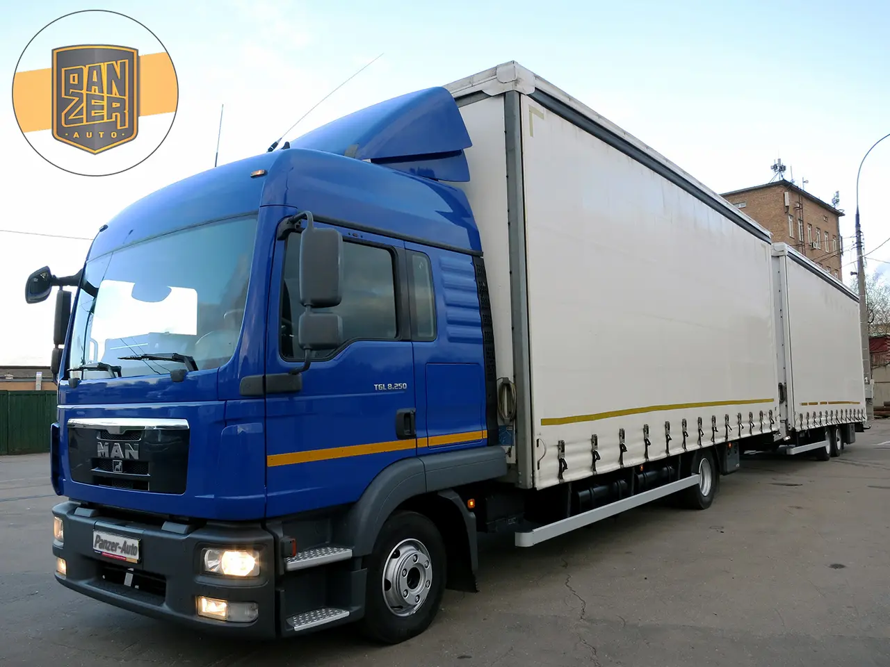 Автопоезд МАН ТГЛ 8.250 120 кубов шторный с воротами, 2013 год, без ПЛАТОНа, без пробега по РФ - фото