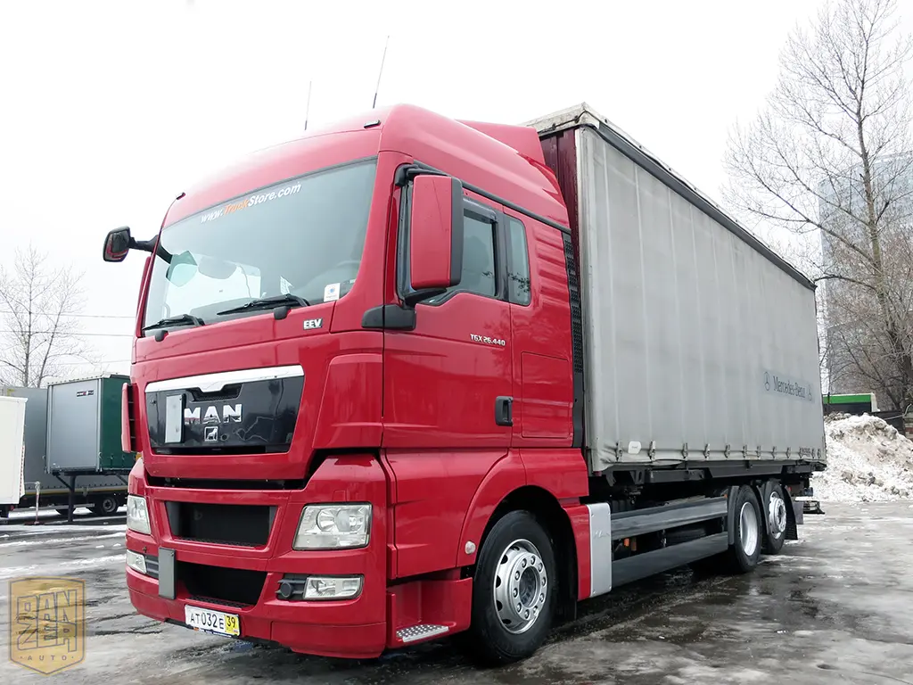 MAN TGX 26.440, тент-штора 52м3, 6х2, 16 тонн, 2011г, высокая кабина - фото