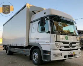 Грузовик тентованный Mercedes Atego 1229, 2012 год | photo 0