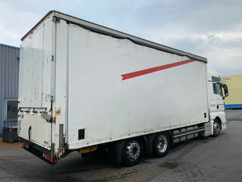 Грузовик тентованный MAN TGX 24.480, 2014 год | photo 1