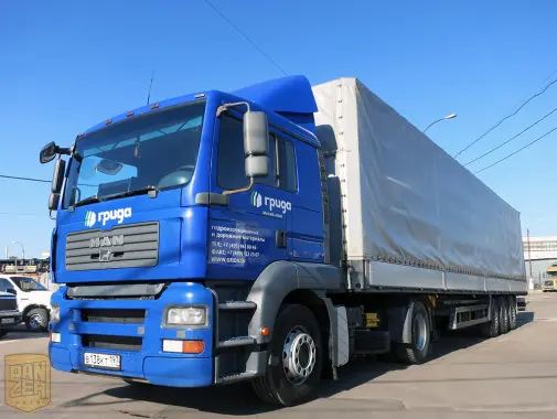 Тягач MAN TGA 18.480 с полуприцепом Schmitz S01, сдвижной тент 92 м3 - фото