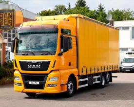 Грузовик тентованный MAN TGX 26.440, 2015 год | photo 0