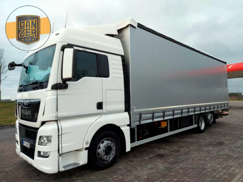 Грузовик тентованный MAN TGX 26.440, 2013 год | photo 0